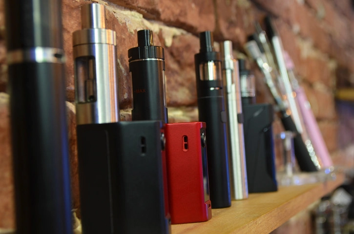 Coils, chargers, drip tips, and vape components displayed at a North Miami shop