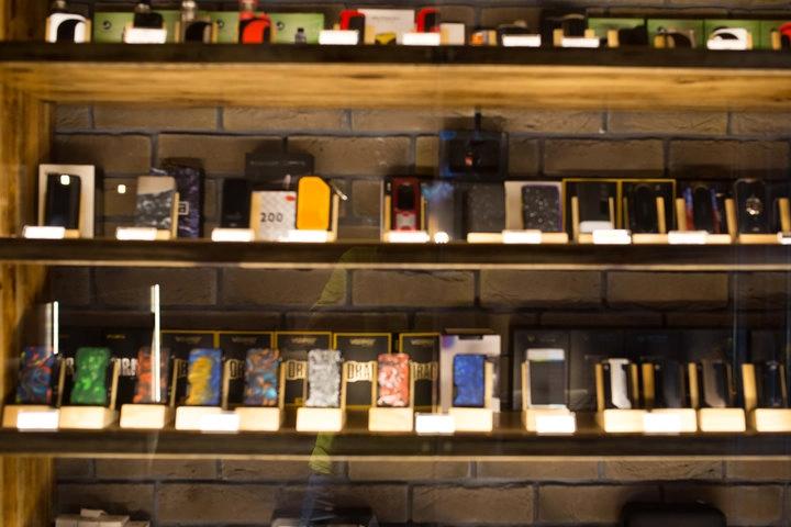 Interior of a North Miami tobacco shop displaying premium cigars, tobacco products, and accessories
